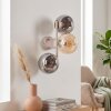 Modern vägglampa Gastor med tre runda rökfärgade och amberfärgade glaskupor
