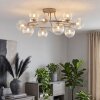 Modern klustertaklampa Chehalis i sandfärg med 12 räfflade klarglaskupor