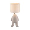 Leuchten Direkt bordslampa TED med stiliserad figurfot och beige skärm