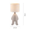 Leuchten Direkt bordslampa TED med stiliserad figurfot och beige skärm